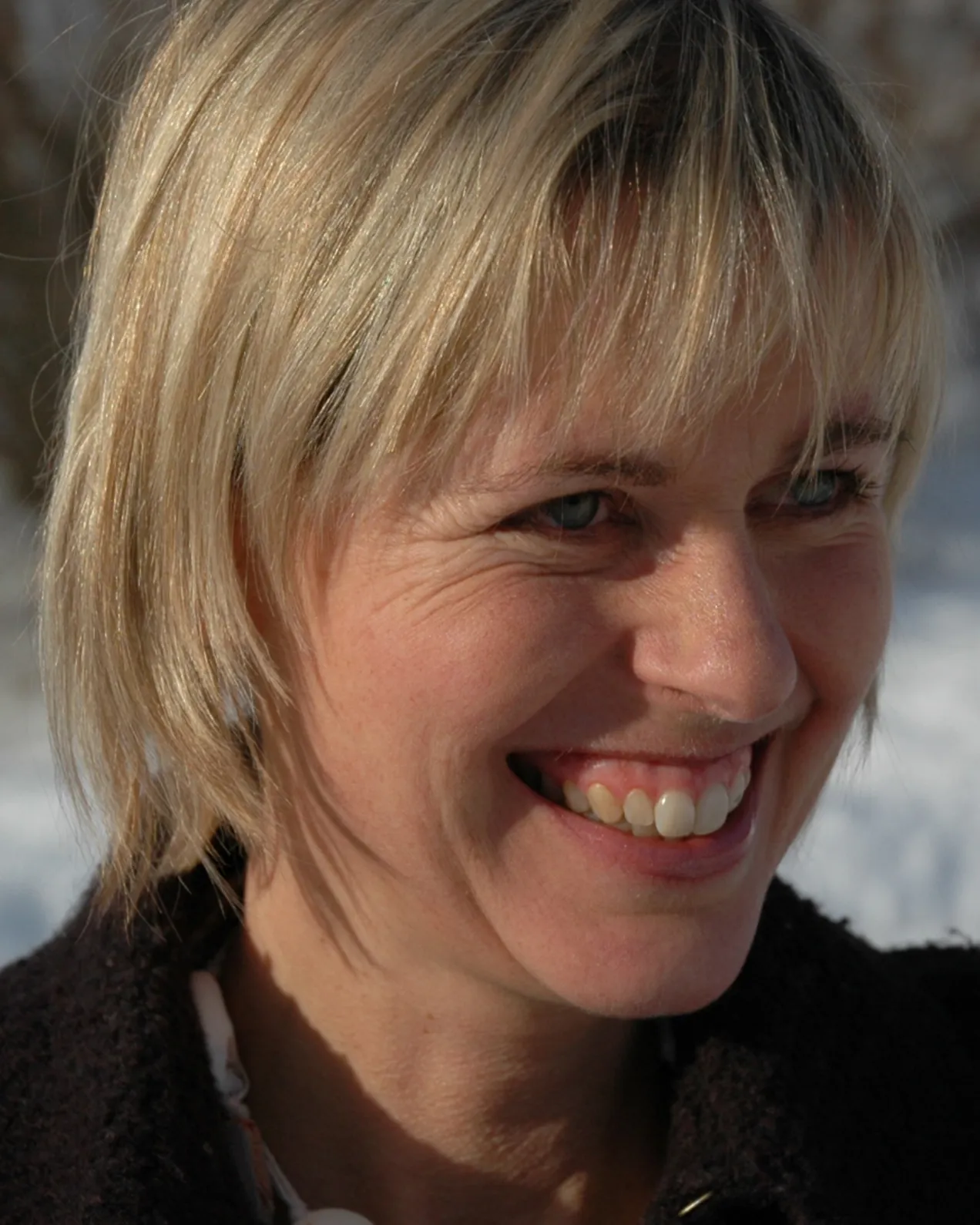 A close-up of a woman smiling