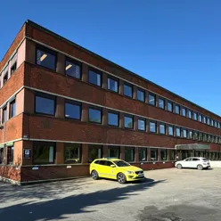 A building with cars parked in front