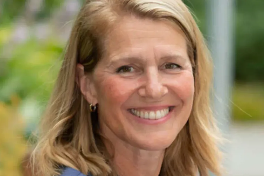A close-up of a woman smiling