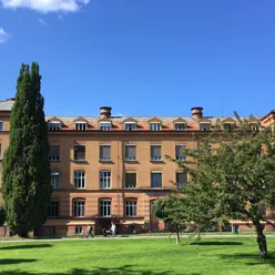 A large brick building with trees in front of it