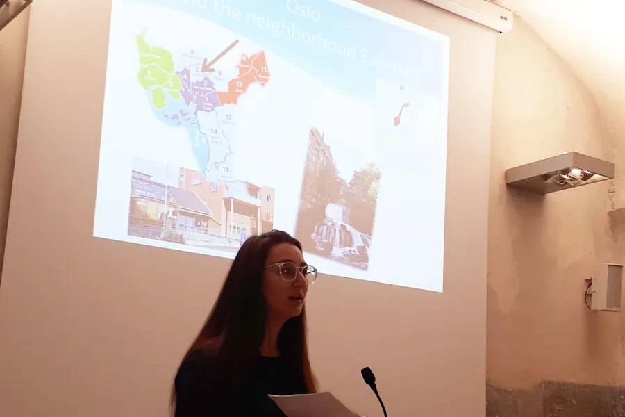 Marlene Falieras presenterer foreløpige forskningsresultater på Integrated Care and Assertive Outreach-konferansen i Verona.